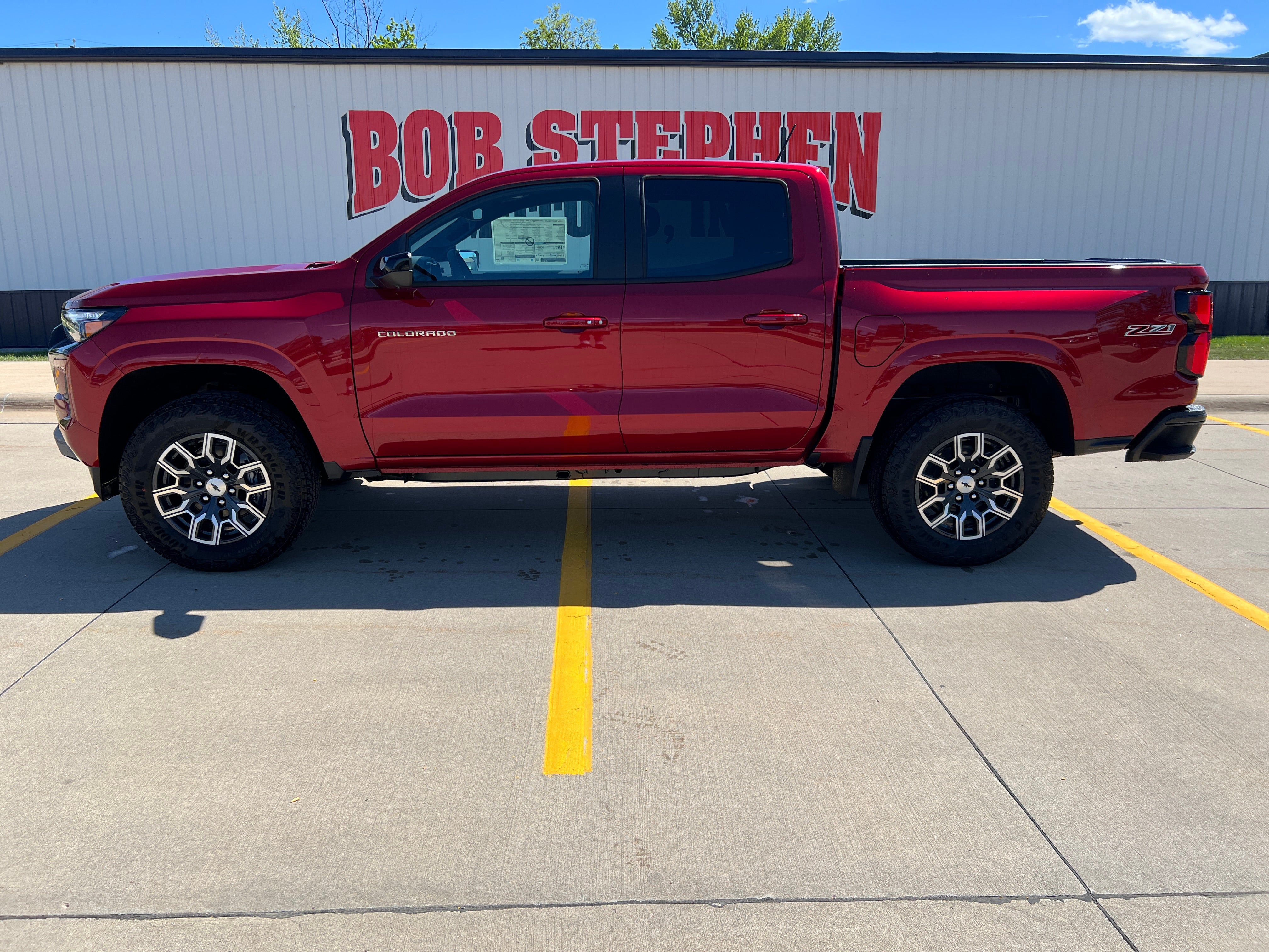 2026 Chevrolet Colorado Z71 in Radiant Red Tintcoat — front three-quarter view