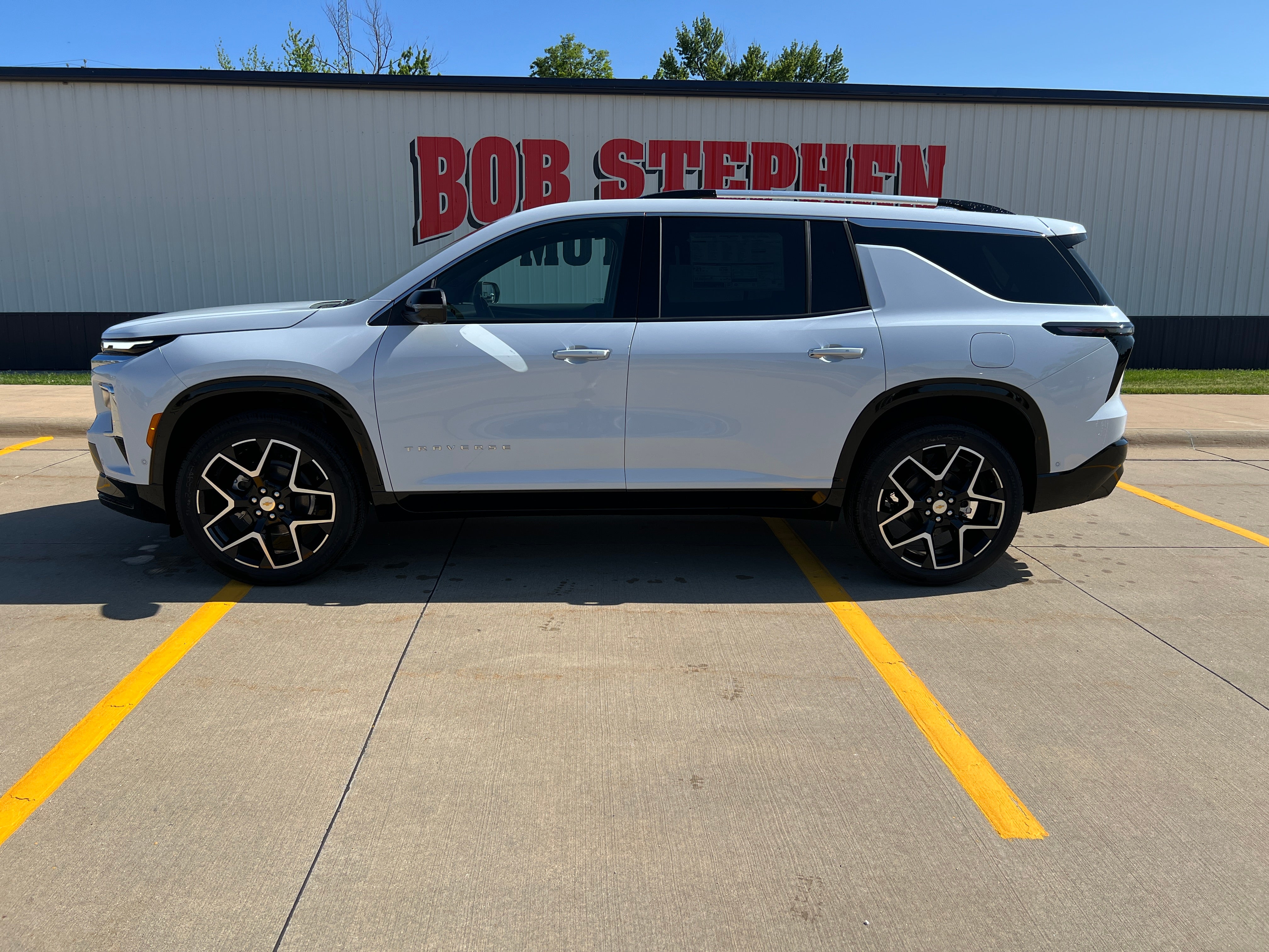 2026 Chevrolet Traverse High Country in Polar White Tricoat — front three-quarter view