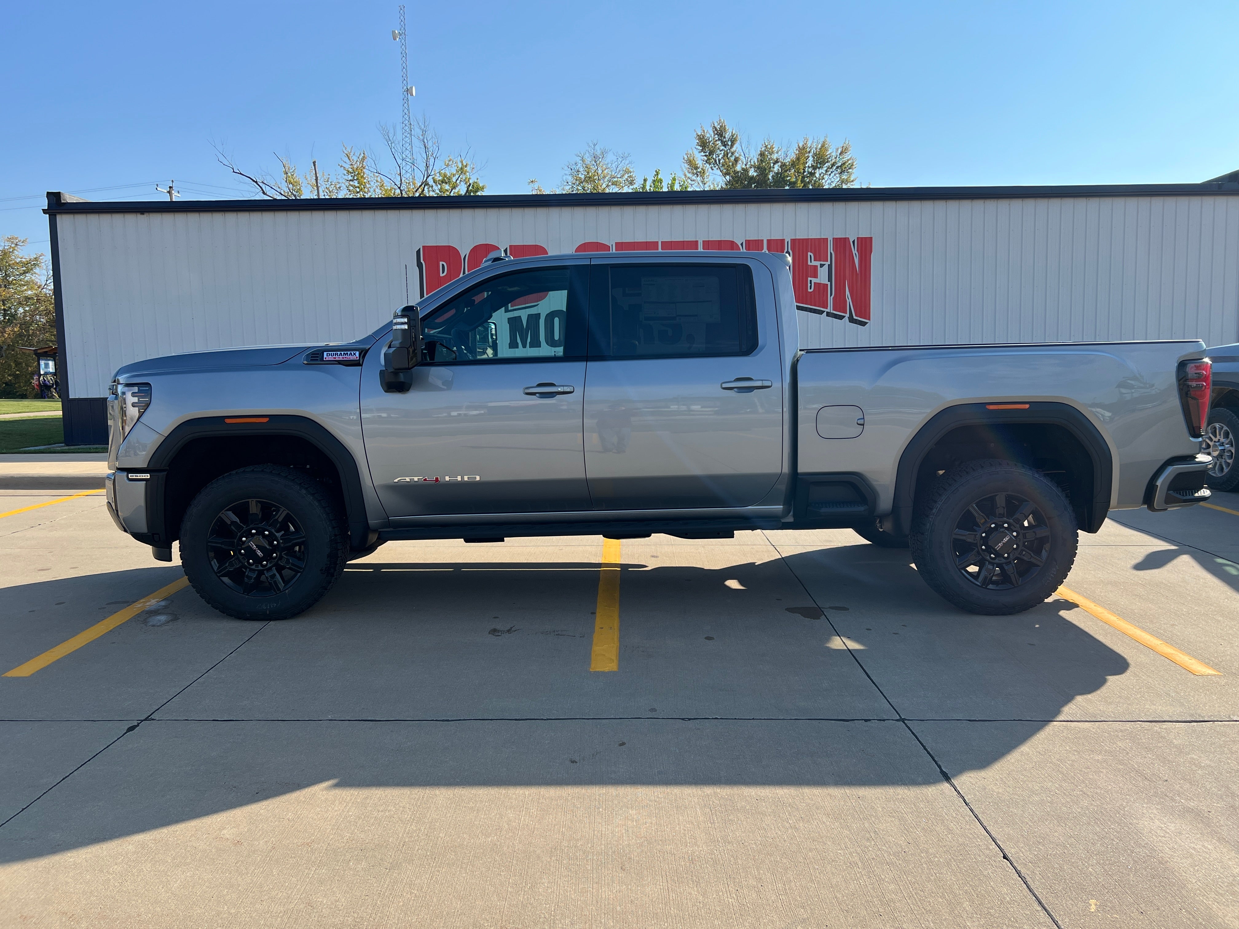 2026 GMC Sierra 2500 HD AT4 in Sterling Metallic — front three-quarter view