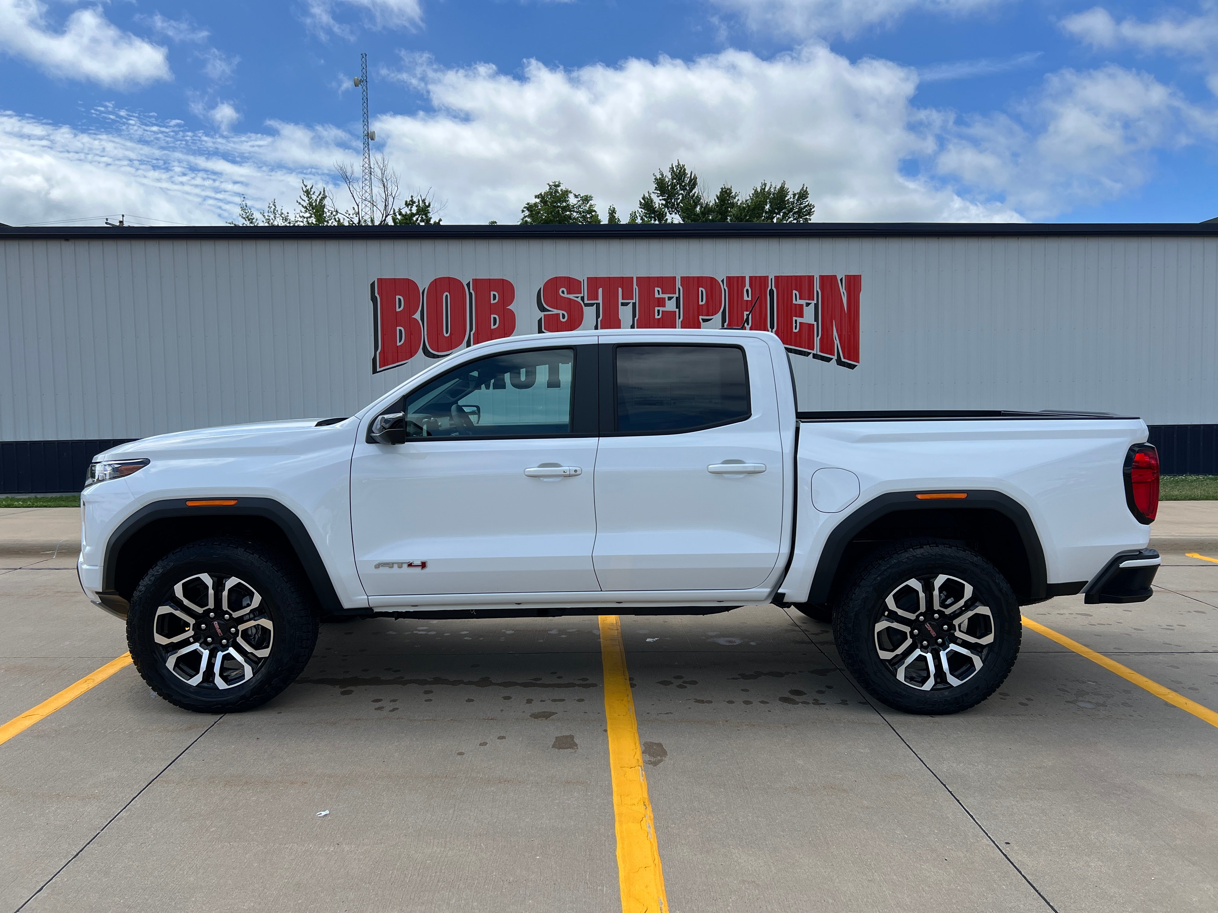 2026 GMC Canyon AT4 in Summit White — front three-quarter view