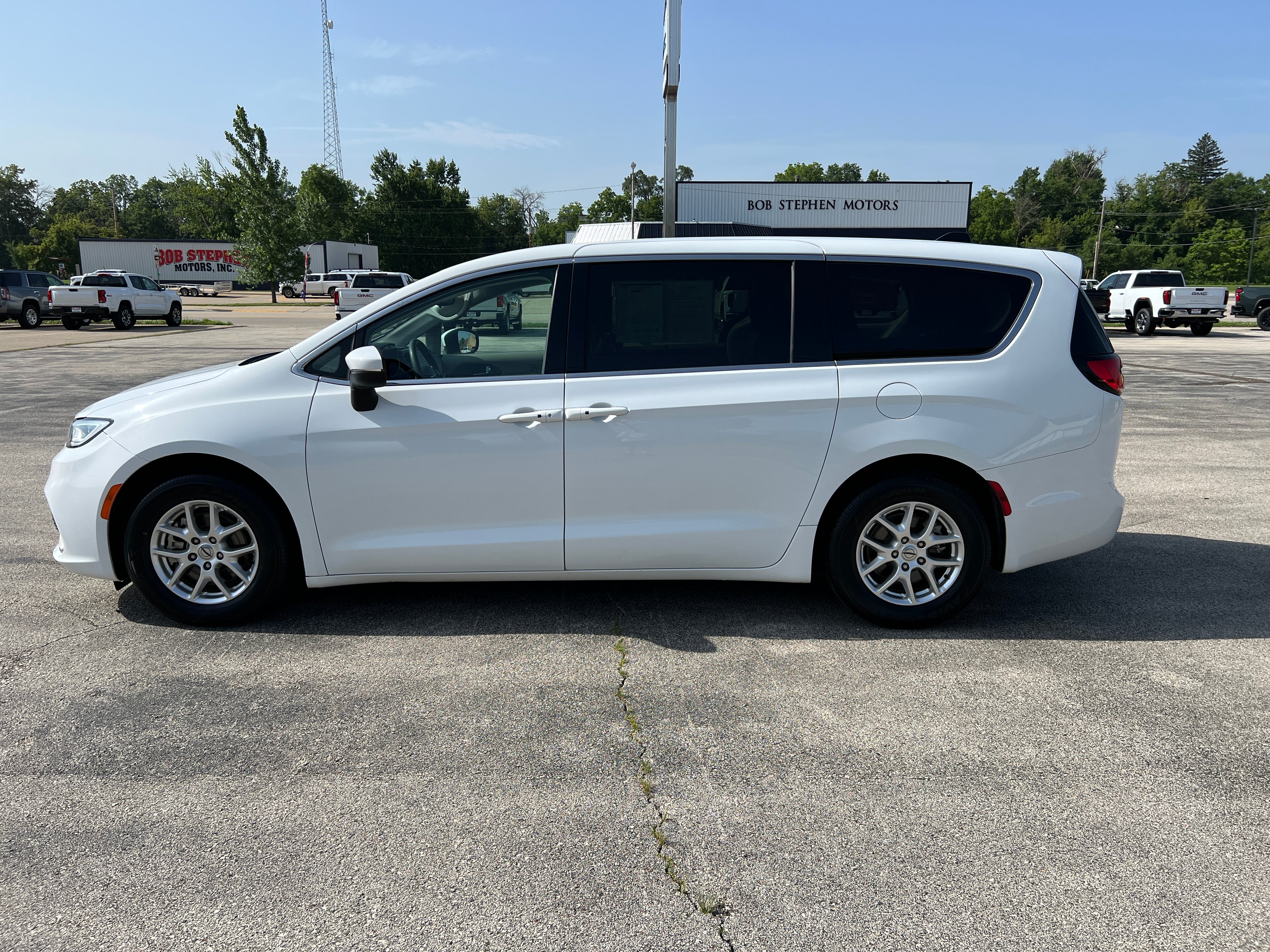 2023 Chrysler Pacifica Touring L in White — front three-quarter view