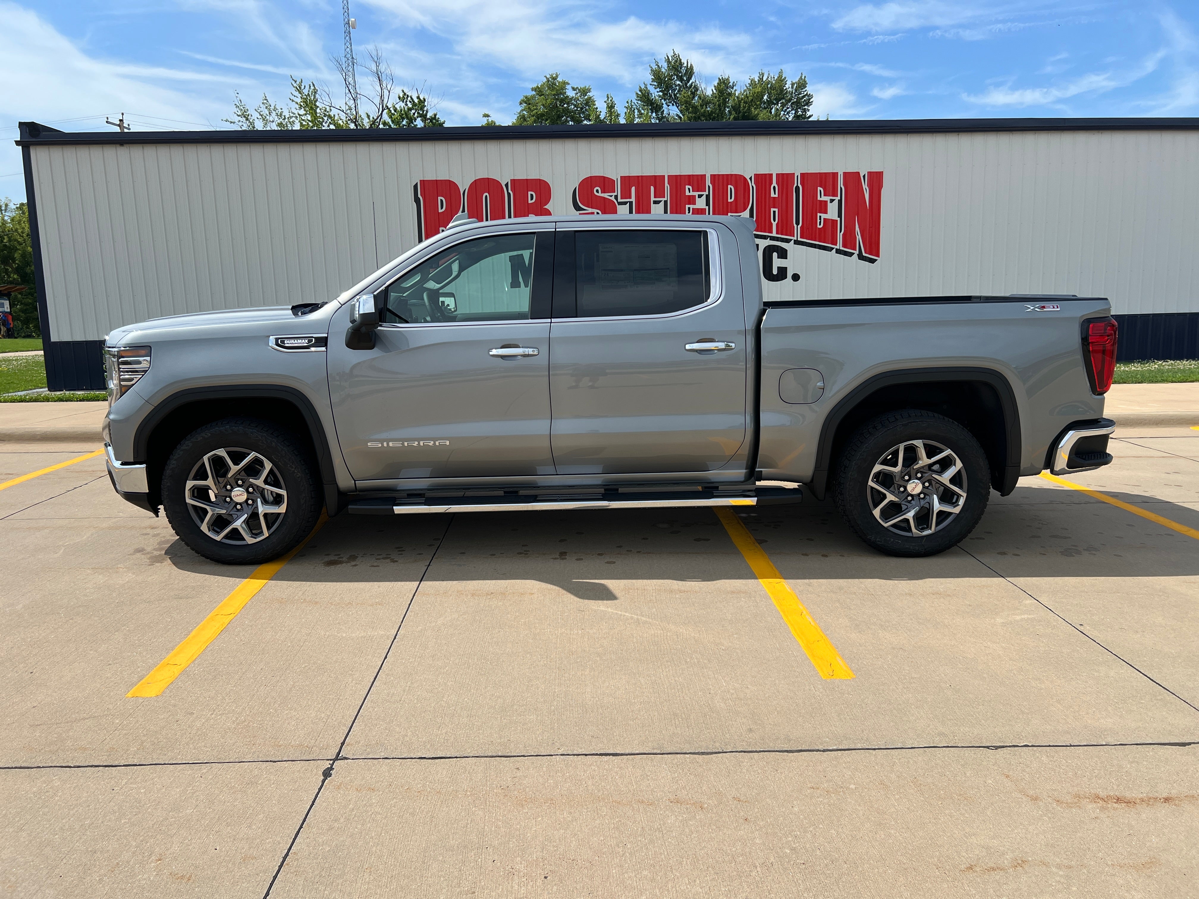 2026 GMC Sierra 1500 SLT in Sterling Metallic — front three-quarter view