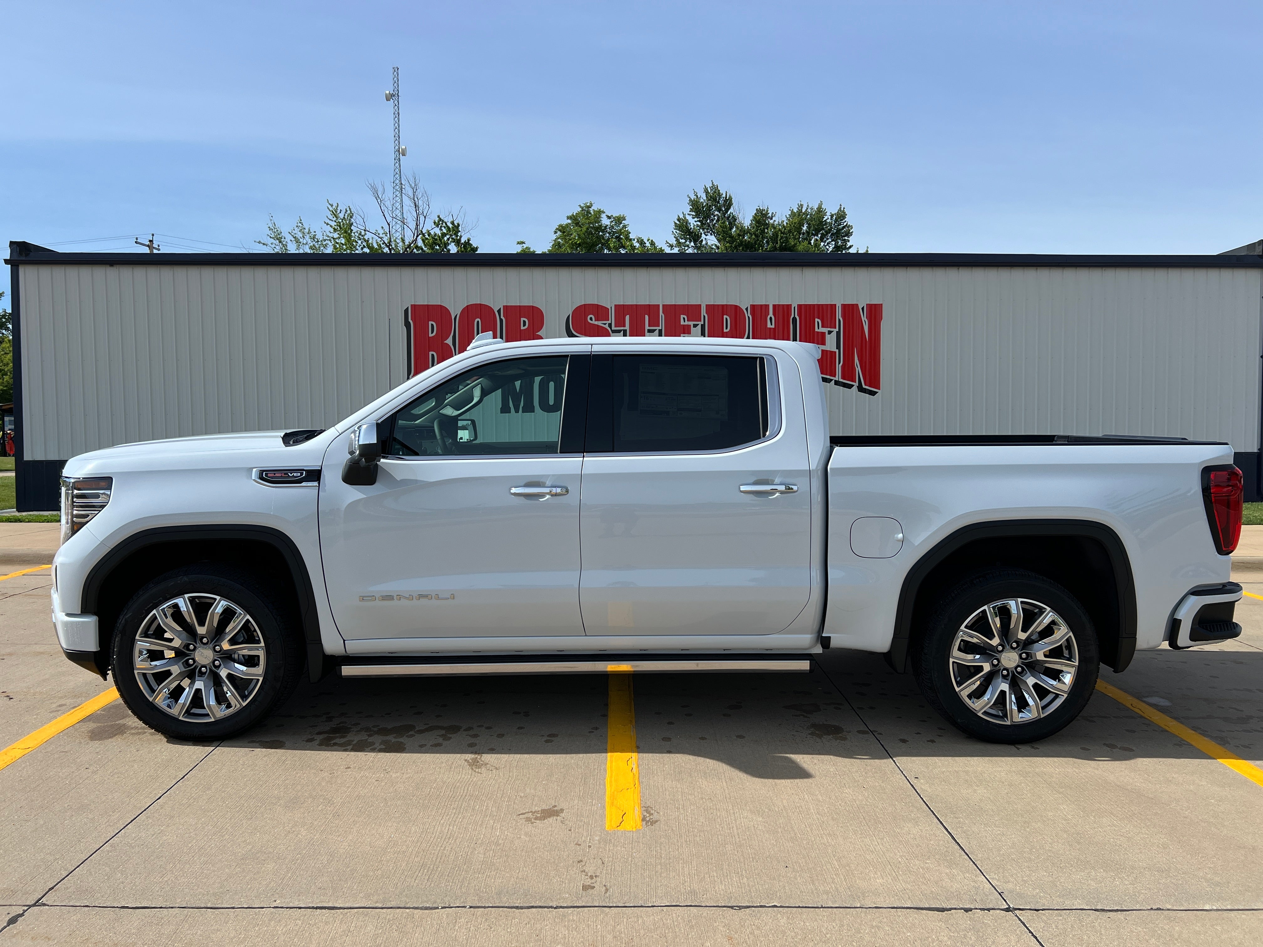 2026 GMC Sierra 1500 Denali in Glacier White Tricoat — front three-quarter view